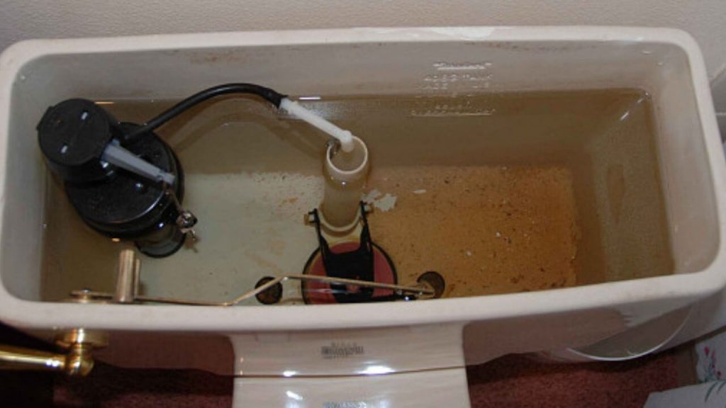 How should the inside of a toilet tank look